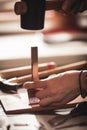 Leather handbag craftsman at work in a vintage workshop. Small business concept