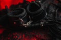 Leather handcuffs and whip for BDSM role-playing sex games Royalty Free Stock Photo