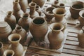 Leather hard handcraft clay pots waiting for dry and bisque fire in pottery process Royalty Free Stock Photo
