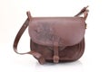 Leather hunting bag with brown ornament with patronage on white isolated background