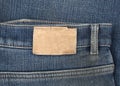 Leather jeans label sewed on a blue jeans
