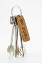 Leather key chain with keys on isolated white background. My home Royalty Free Stock Photo