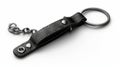 A leather keychain holder with metal ring and chain. Modern realistic template of a black fob isolated on white. Blank Royalty Free Stock Photo