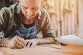 Leather maker artist handcraft working at own workshop small studio made by order masterwork piece Royalty Free Stock Photo