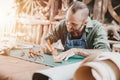 Leather maker artist handcraft working at own workshop small studio made by order masterwork piece Royalty Free Stock Photo