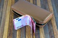 Leather mens open wallet with Euro and dollar banknotes bills Royalty Free Stock Photo
