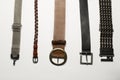 Leather and metal belts isolated on a white background Royalty Free Stock Photo