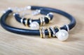 Leather necklace and bracelet with pearl. Royalty Free Stock Photo