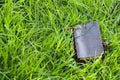 Leather notebook on grass