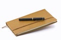 Leather notebook and pen isolated Royalty Free Stock Photo