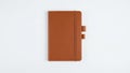 Leather notebook with a smooth texture is displayed against a Royalty Free Stock Photo