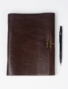 Leather notepad with drawing pencil Royalty Free Stock Photo