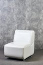 Leather office chair in empty room with gray texture wall background Royalty Free Stock Photo