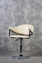 Leather office chair in empty room with gray texture wall background Royalty Free Stock Photo