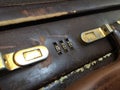 Combination lock Leather briefcase closeup on white background