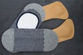 Leather orthopedic insoles with socks. Stone background. Top vie