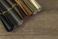 Leather rolls on the wooden background