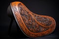 leather saddle with intricate tooling patterns