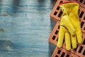 Leather safety gloves red bricks on wooden board bricklaying con Royalty Free Stock Photo