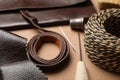Leather samples and tools on table Royalty Free Stock Photo
