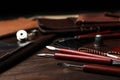 Leather samples and tools on wooden table Royalty Free Stock Photo
