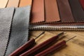 Leather samples and tools on wooden table, closeup Royalty Free Stock Photo