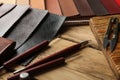 Leather samples and tools on wooden table Royalty Free Stock Photo