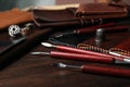 Leather samples and tools on table Royalty Free Stock Photo