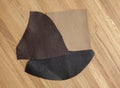 Leather samples on wooden background Royalty Free Stock Photo