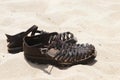 Leather Sandals on Sand Royalty Free Stock Photo