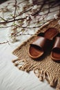 Leather sandals on a woven rug with artistic shadows, casual elegance. AI Generated Royalty Free Stock Photo