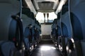 Leather seats in the bus that are clean and modern inside the bus