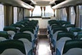 Leather seats in the bus that are clean and modern inside the bus