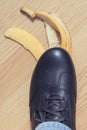 Leather shoe before slipping on banana peel Royalty Free Stock Photo