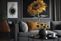 Leather sofa next to table with sunflowers in grey living room interior with posters. Real photo Royalty Free Stock Photo