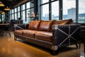 leather sofa with riveted steel frame in a spacious loft Royalty Free Stock Photo