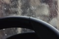 Leather steering wheel, rain windshield bokeh