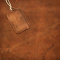 Leather tag on suede