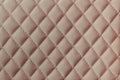 Leather texture background. The leather is pink stitched with thread