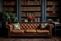 a leather upholstered chesterfield sofa in a study with bookshelves Royalty Free Stock Photo