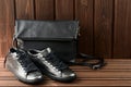 Leather upper metallic womens shoes and black leather bag on bro