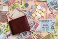 Leather wallet with 1000 rupees note and other Indian notes and coins Royalty Free Stock Photo