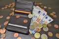 Leather wallet with various euro banknotes and coins Royalty Free Stock Photo