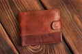 Leather wallet on a wooden background Royalty Free Stock Photo