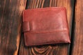 Leather wallet on a wooden background Royalty Free Stock Photo