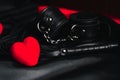 Leather whip and handcuffs for BDSM sex with red hearts as a symbol of Valentine`s day Royalty Free Stock Photo