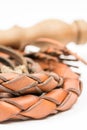 Leather whip isolated over white background closeup macro Royalty Free Stock Photo