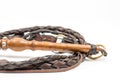Leather whip isolated over white background closeup macro Royalty Free Stock Photo