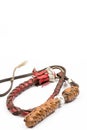 Leather whip isolated over white background closeup macro Royalty Free Stock Photo