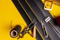 Leather working or Leather craft. Black tanned leather on leather craftman`s work desk . Working tools on a work table Royalty Free Stock Photo